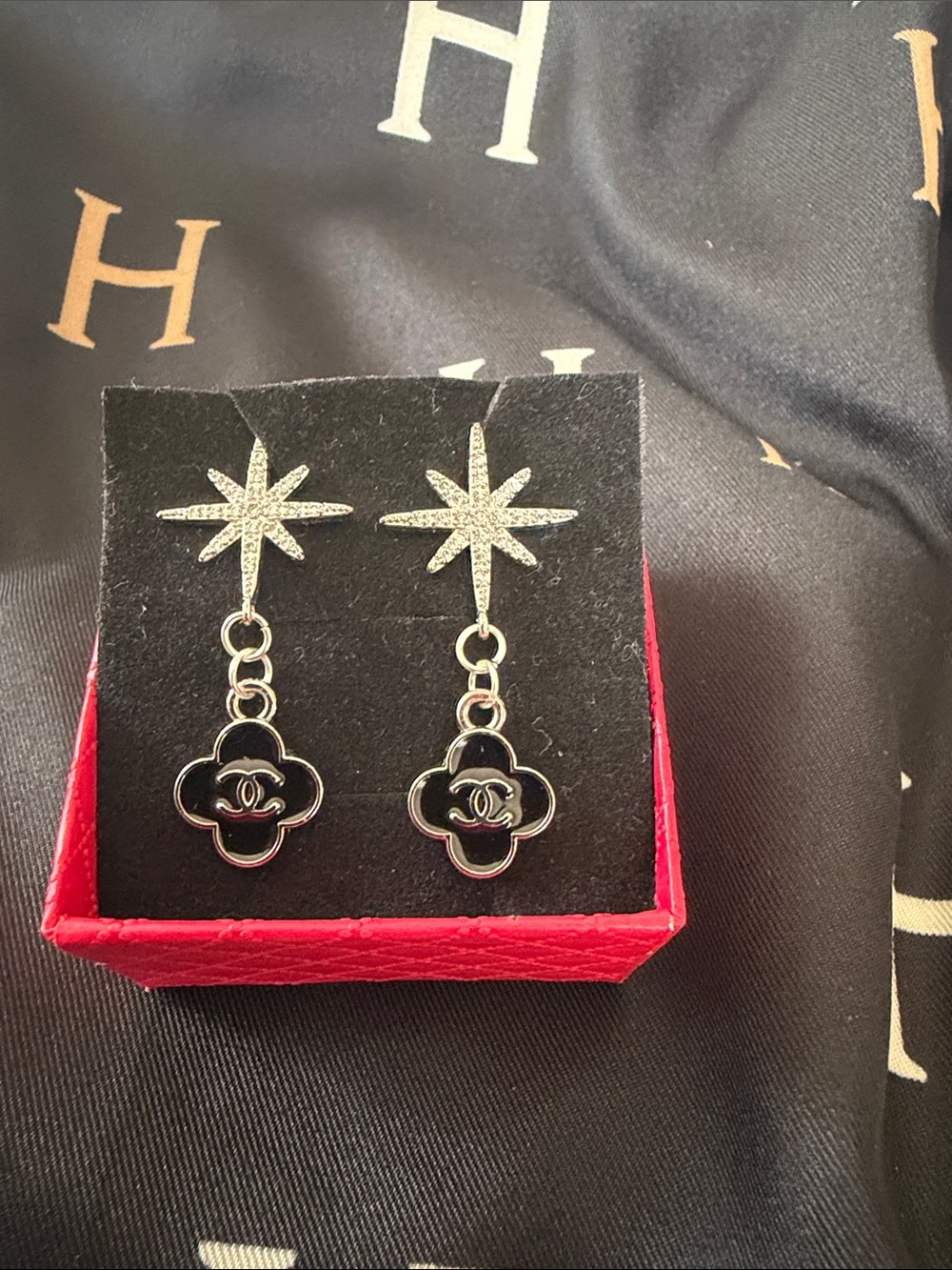 Handcrafted Silver Star Drop Earrings with Black Clover Charm